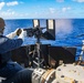 Master-at-Arms 1st Class Byron Hunt, mans the .50 caliber machine gun during a live-fire-exercise