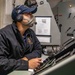 Gunners Mate 2nd Class Jacob Lazos conducts testing on Barry's Mark 45 5-inch gun