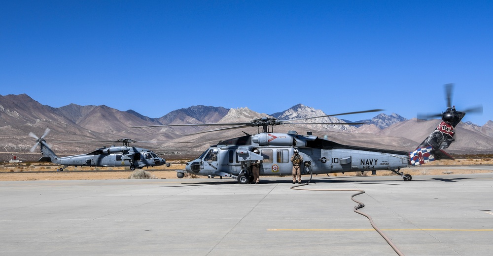 Helicopter Sea Combat Squadron (HSC) 4 Conducts Air Delivered Ground Refueling (ADGR) Evolution with Navy CMV-22B Osprey