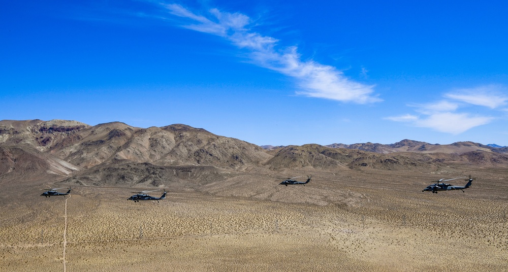 Four MH-60S Knighthawk Helicopters of HSC 4 Fly in Formation