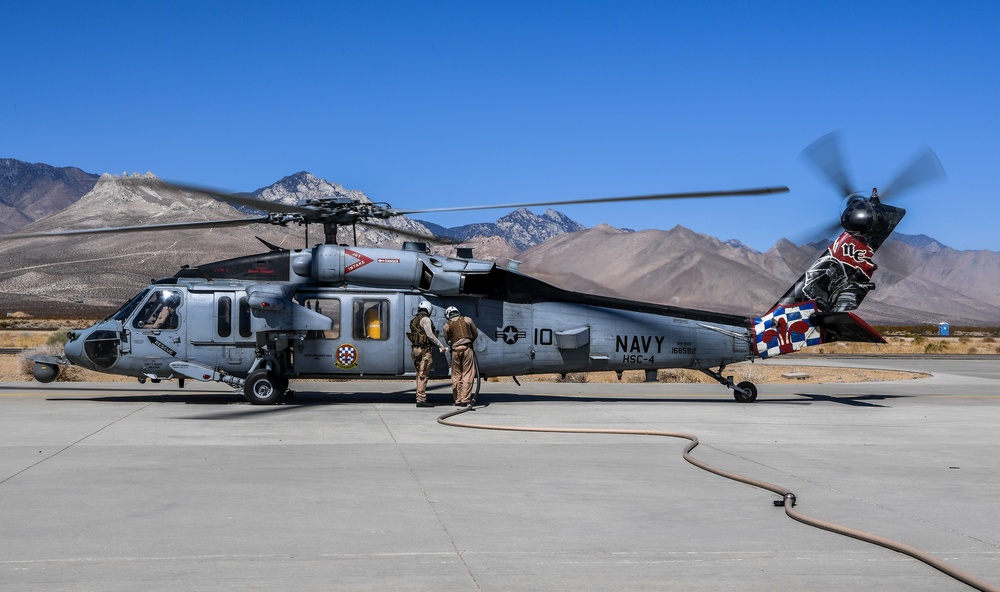 Helicopter Sea Combat Squadron (HSC) 4 Conducts Air Delivered Ground Refueling (ADGR) Evolution with Navy CMV-22B Osprey