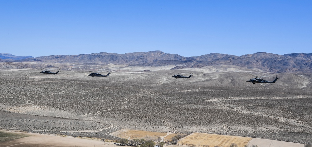 Four MH-60S Knighthawk Helicopters of HSC 4 Fly in Formation