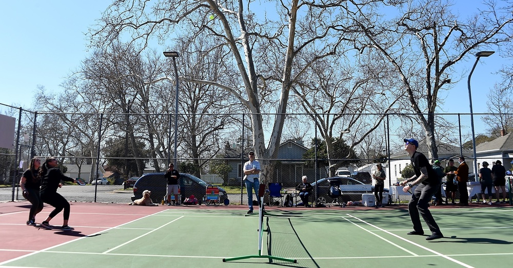 Cal Guard Soldiers receive a pickleball lesson from Red Bluff community members