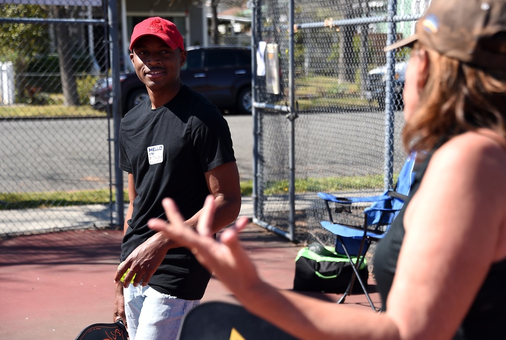 Cal Guard Soldiers receive a pickleball lesson from Red Bluff community members
