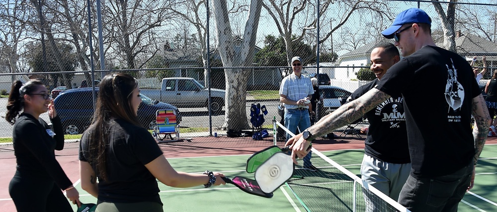 Cal Guard Soldiers receive a pickleball lesson from Red Bluff community members