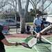 Cal Guard Soldiers receive a pickleball lesson from Red Bluff community members