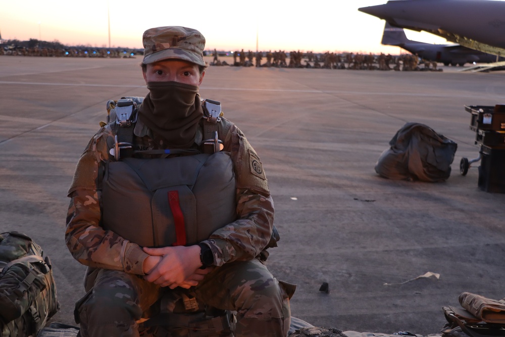 1st Brigade Combat Team, 82nd Airborne Division Soldier awaits plane loading at dusk for jump