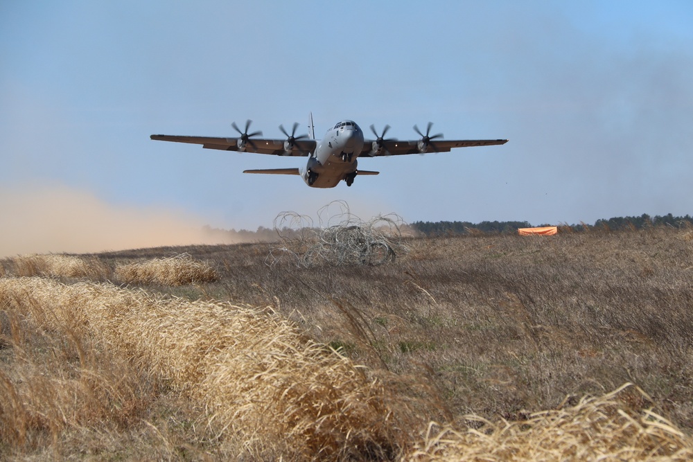 U.S Airforce cargo plane take off in dust filed with blue sky at the Joint Readiness Training Center