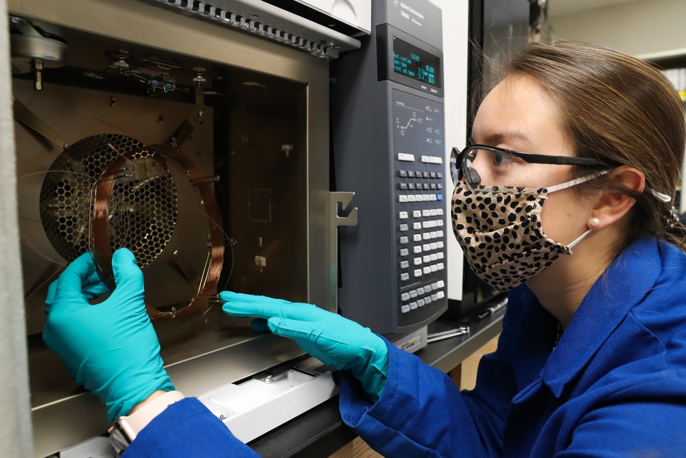 Scientist Meghan Griffiths prepares a gas chromatograph mass spectrometer for analyses