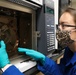 Scientist Meghan Griffiths prepares a gas chromatograph mass spectrometer for analyses