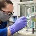 Scientist Nicolette Whitaker accurately weighs a sample