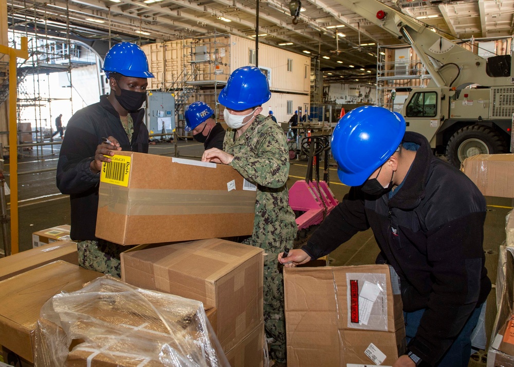 GHWB Sailors sort packages