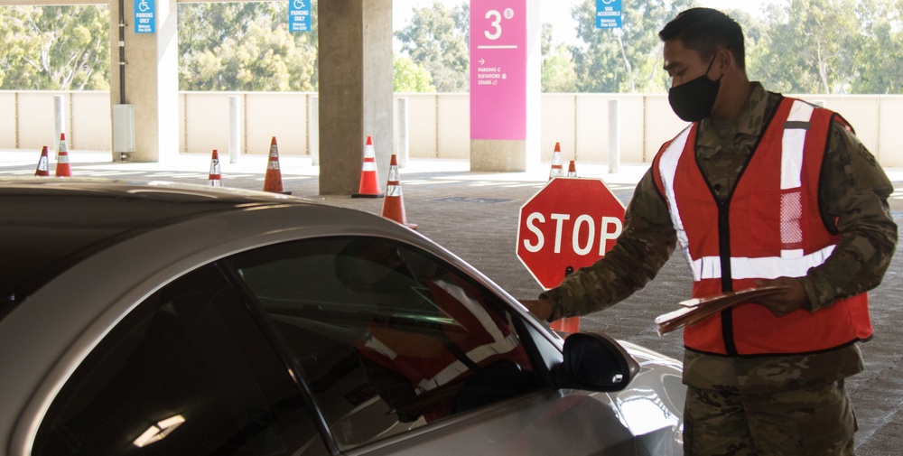 U.S. Army Soldiers manage drive-up operations at Cal State LA CVC