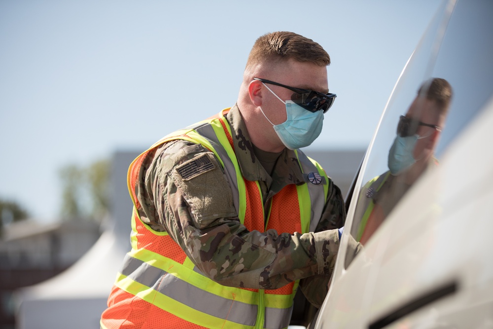 U.S. Army Soldiers manage drive-up operations at Cal State LA CVC