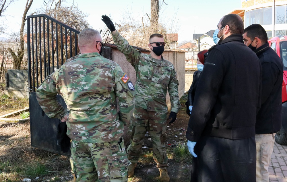 KFOR Soldiers help clean up cemetery