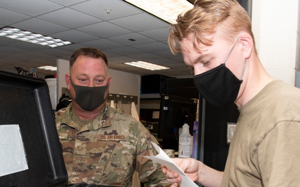 Photo of 116th and 461st Maintenance Squadron's Propulsion Flight Airmen inspect an aircraft launch kit