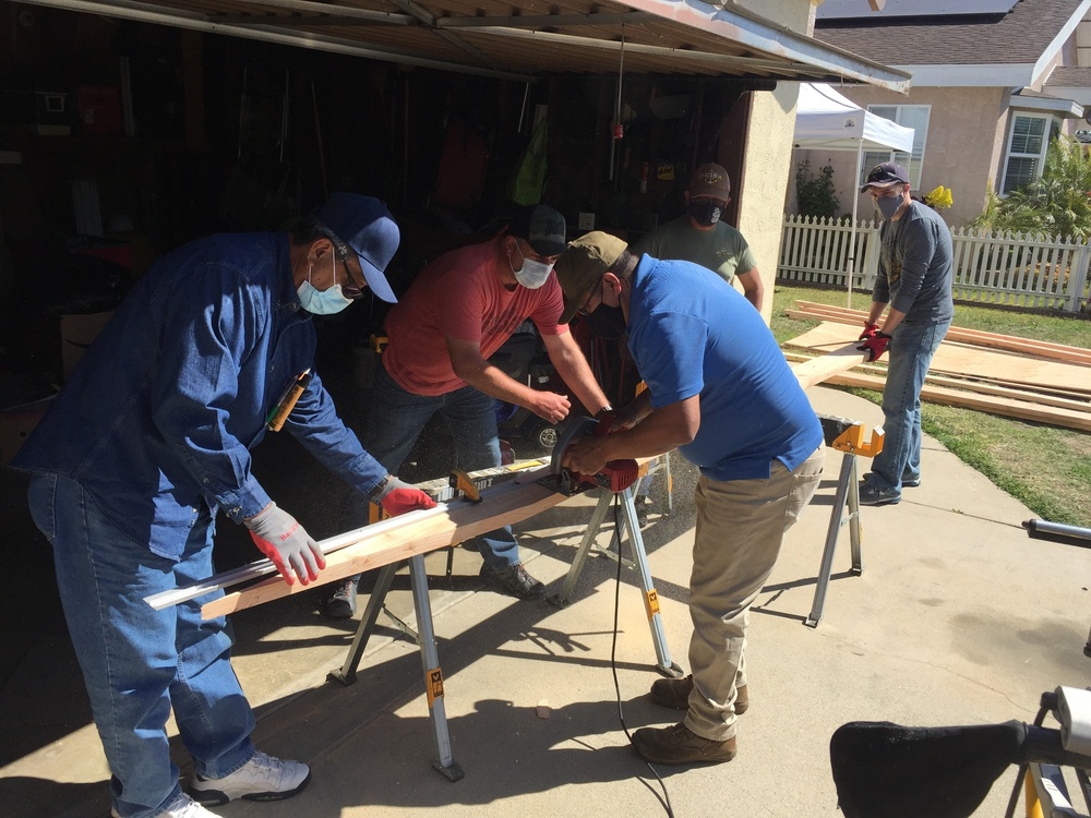 Los Angeles Chiefs build wheelchair ramp for retired Senior Chief Cosgrove.
