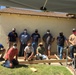 U.S. Navy Chief Petty Officers build wheelchair ramp for retired Senior Chief Cosgrove.