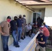 Los Angeles Chiefs build wheelchair ramp for retired Senior Chief Cosgrove.