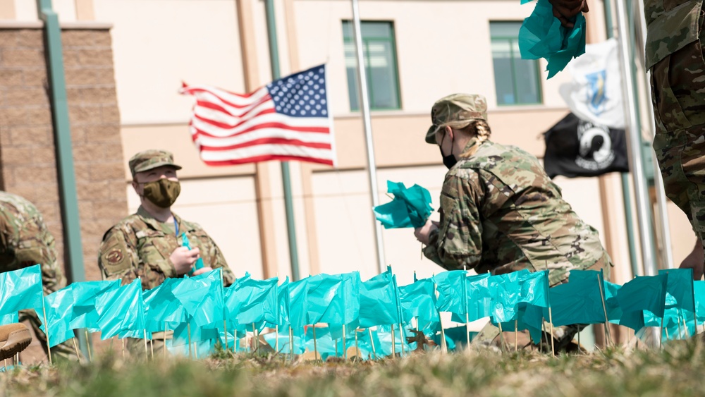 Airmen Promote Sexual Assault Awareness and Prevention Month by planting SAPR Flags