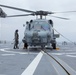 Australian sailors launch Sea Hawk helicopters aboard USS John Finn
