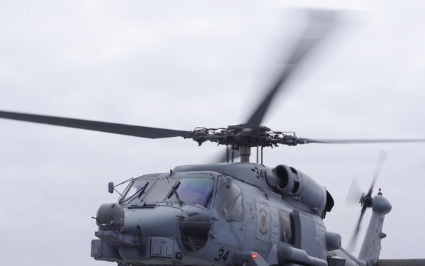 Australian sailors launch Sea Hawk helicopters aboard USS John Finn