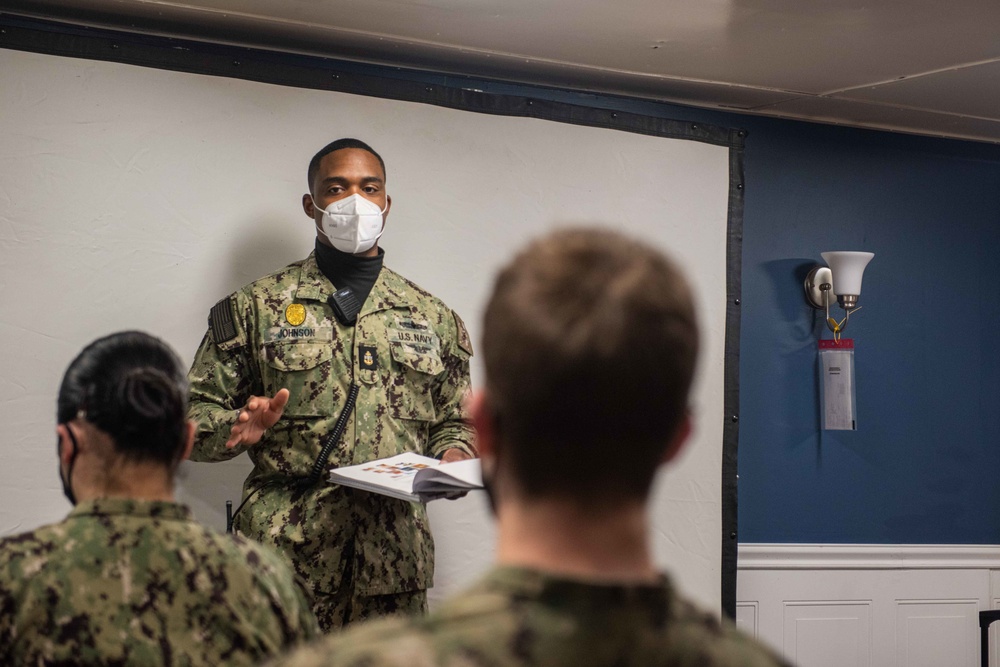 Sailor delivers a brief prior to an anti-terrorism training team drill