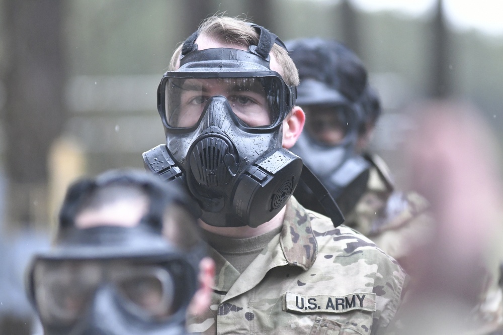 Military police don gas masks for annual training