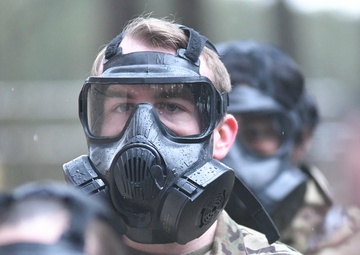 Military police don gas masks for annual training
