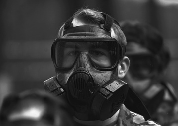 Military police don gas masks for annual training
