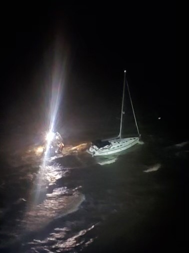 Coast Guard rescues 3 from an aground vessel near Fort Morgan, Ala.