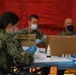 U.S. service members aid vaccination efforts at Elizabeth High School CVC