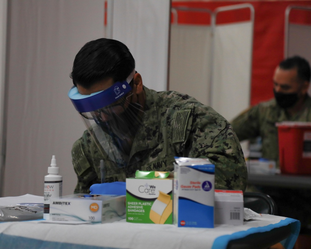 U.S. service members aid vaccination efforts at Elizabeth High School CVC