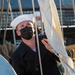 Boatswain’s Mate 2nd Class Kevin Crowder raises the church pennant for USS Constitution’s Easter Sunrise Service