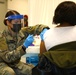 U.S. Army Soldiers aid in administering COVID-19 vaccines at Trenton Central High School CVC