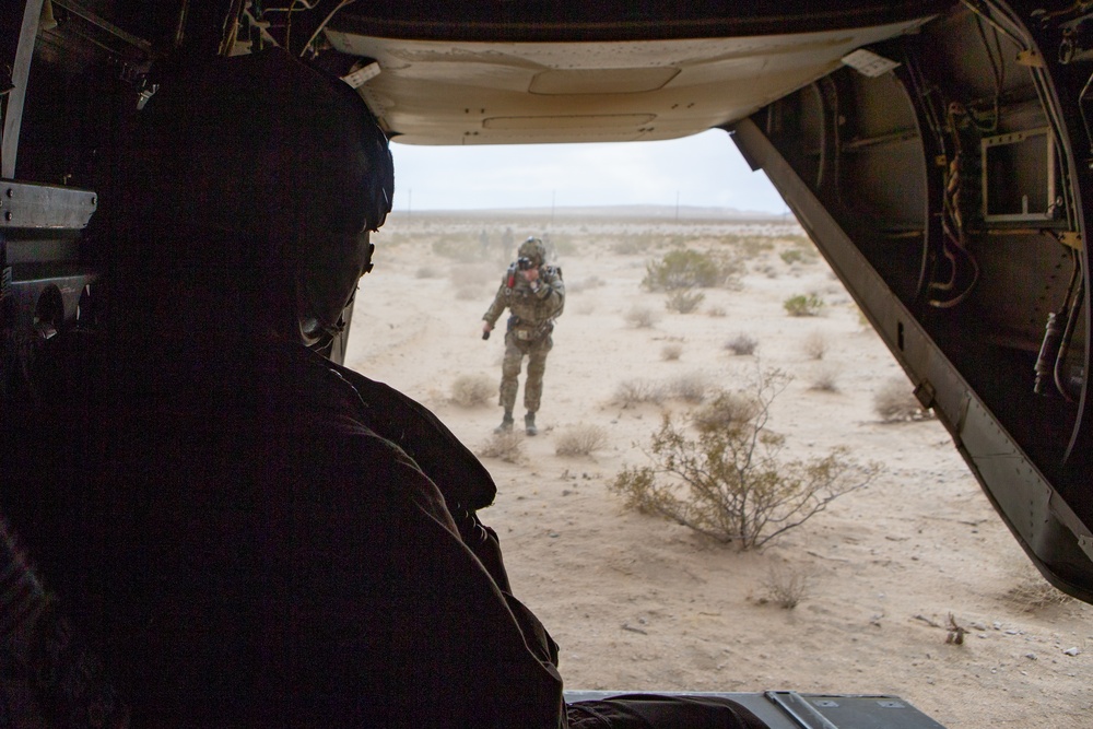 Green Berets jump out of Marine Corps helicopter