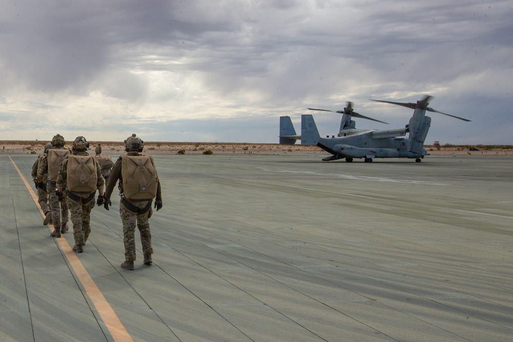 Green Berets jump out of Marine Corps helicopter