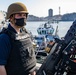 ET3 Alexander James mans a .50-caliber machine gun during sea and anchor detail