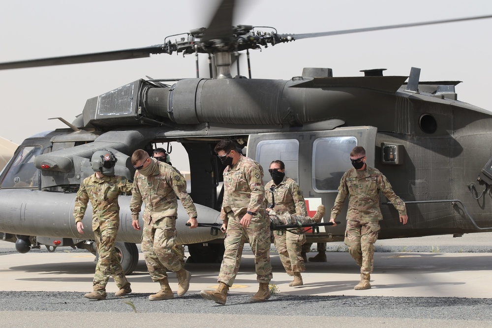 Engineers of Task Force Iron Castle HHC 16th Engineer Brigade, Aviators of 28th Expeditionary Combat Aviation Brigade (ECAB), and Soldiers from Kuwait Land Forces collaborated for a joint medical evacuation (MEDEVAC) training exercise.