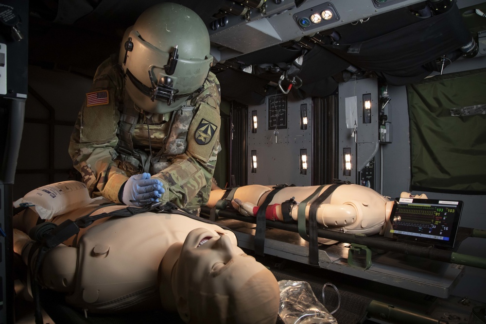 A U.S. Army Aeromedical Research Laboratory flight paramedic tests new items in a space utilization study at the School of Aviation Medicine's DUSTOFF Training complex. The USAARL and SAAM frequently collaborate to make sure the U.S. Army's next generatio