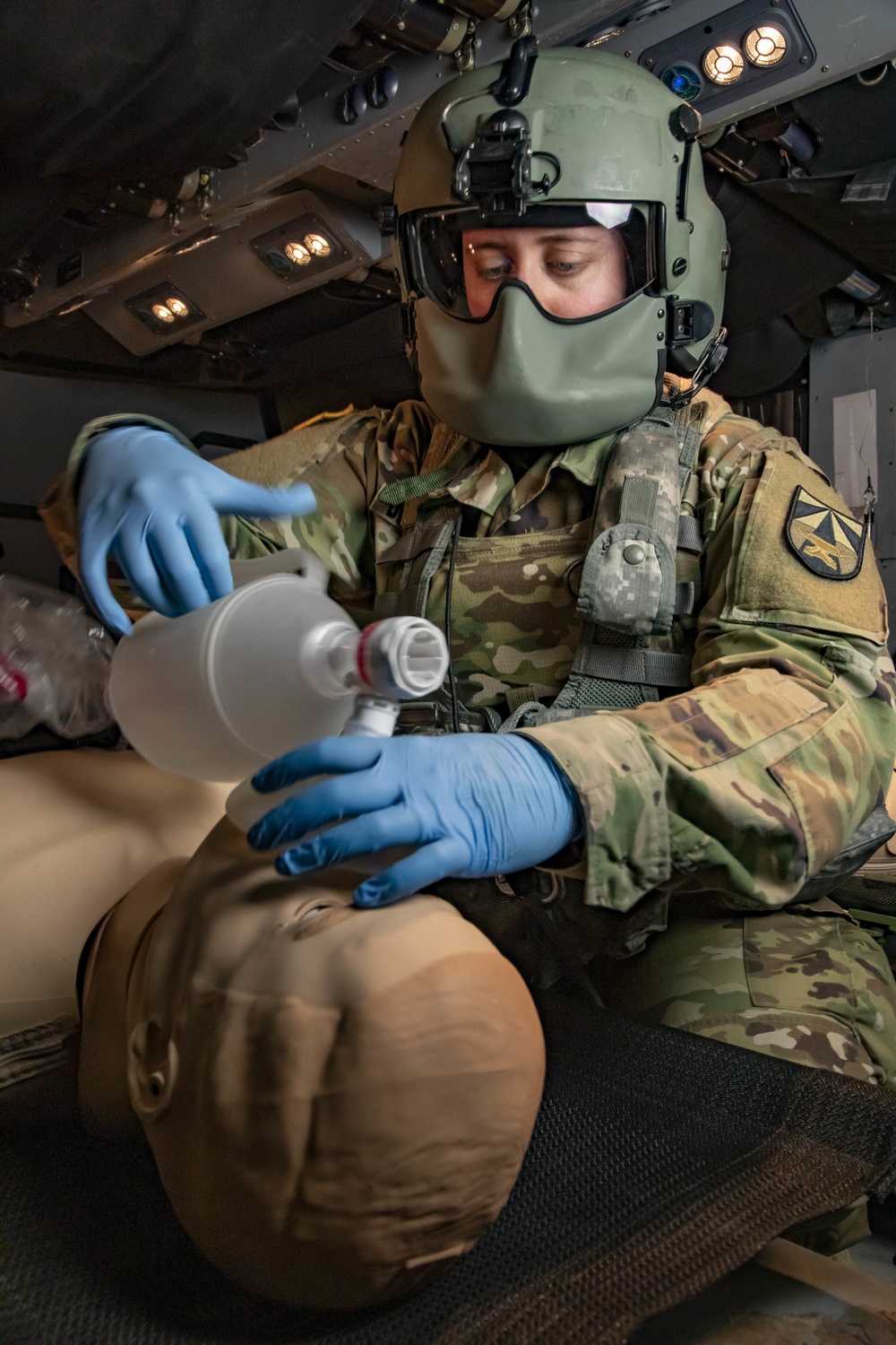 SGT Kelsey Demorest (USAARL flight paramedic with EnRoute Care Research Group) tests new items in a space utilization study at the School of Aviation Medicine's DUSTOFF TRAINING complex. The USAARL and SAAM frequently collaborate to make sure our next gen