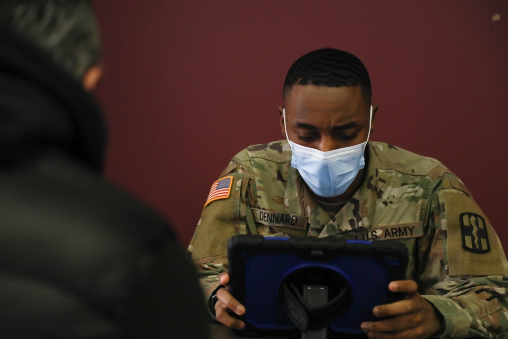 Service Members aid vaccination efforts at the Maureen Collier Memorial Senior Citizens Center CVC