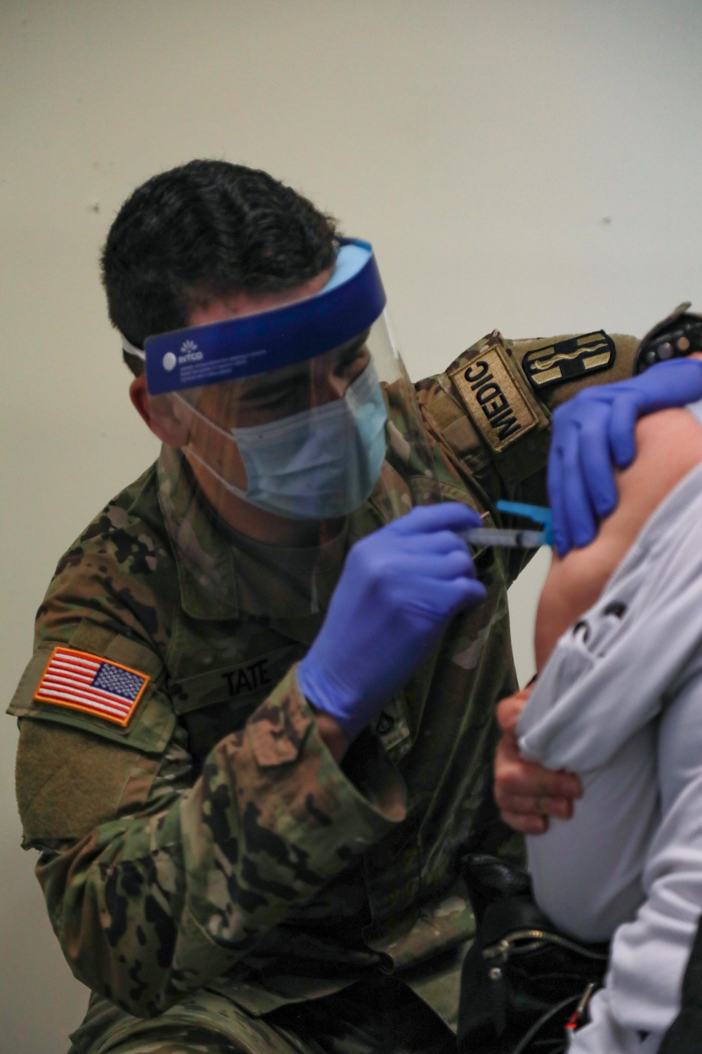 Service Members aid vaccination efforts at the Maureen Collier Memorial Senior Citizens Center CVC