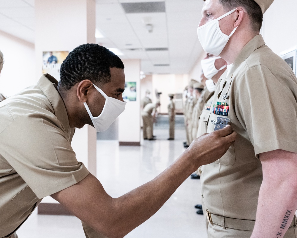 210126-N-TE695-0008 NEWPORT, R.I. (April 1, 2021) Limited Duty Officer/Chief Warrant Officer (LDO/CWO) Academy class conducts a uniform inspection