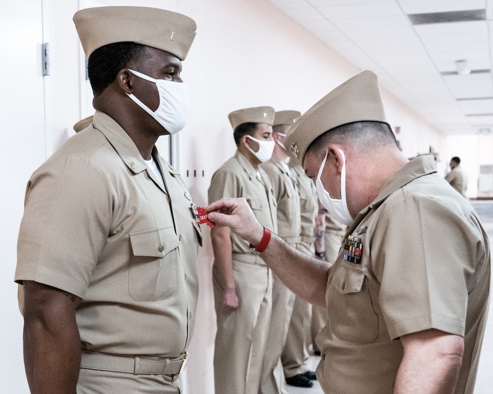 210126-N-TE695-0006 NEWPORT, R.I. (April 1, 2021) Limited Duty Officer/Chief Warrant Officer (LDO/CWO) Academy class conducts a uniform inspection