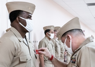 210126-N-TE695-0006 NEWPORT, R.I. (April 1, 2021) Limited Duty Officer/Chief Warrant Officer (LDO/CWO) Academy class conducts a uniform inspection