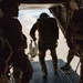 Green Berets jump out of Marine Corps helicopter
