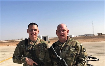 Father and son serve overseas with the 130th Field Artillery Brigade, Kansas Army National Guard