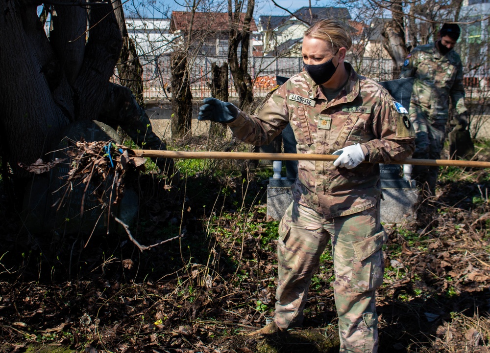KFOR Soldiers help clean up cemetery