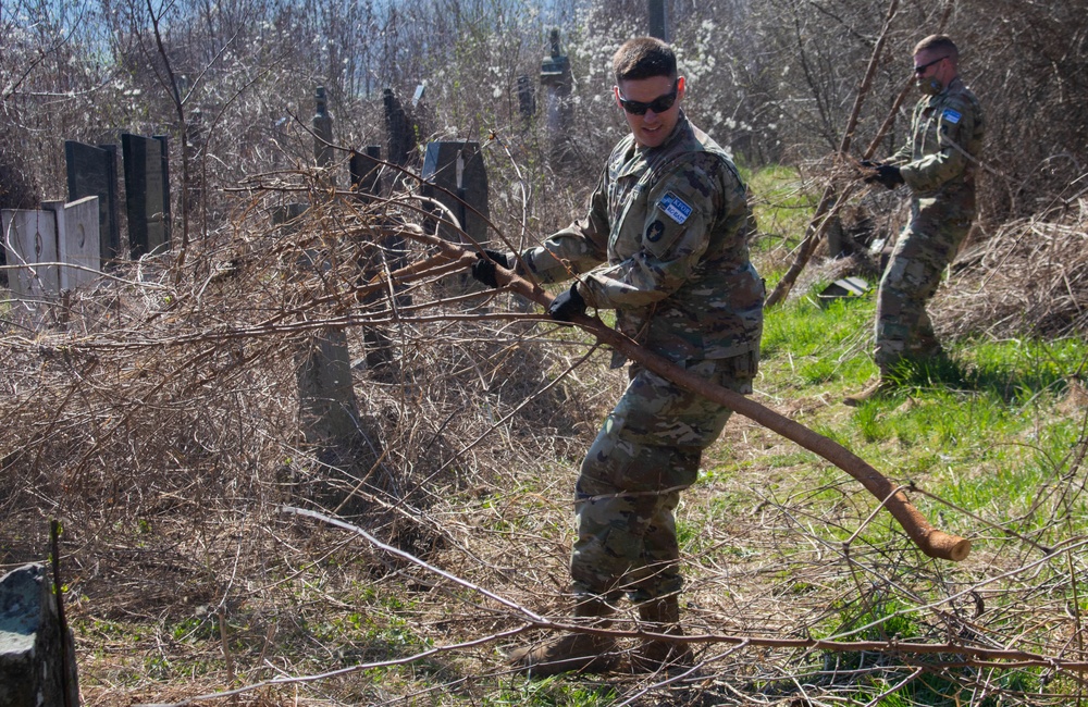 KFOR Soldiers help clean up cemetery